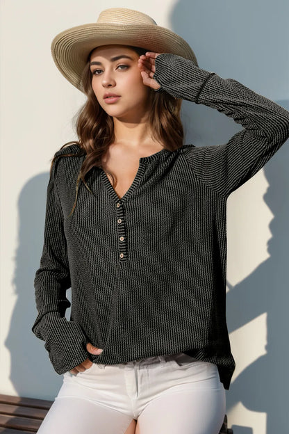 Long sleeve T-shirt by Trendsi featuring notched thumbhole design and full-size fit, in a casual, comfortable style.