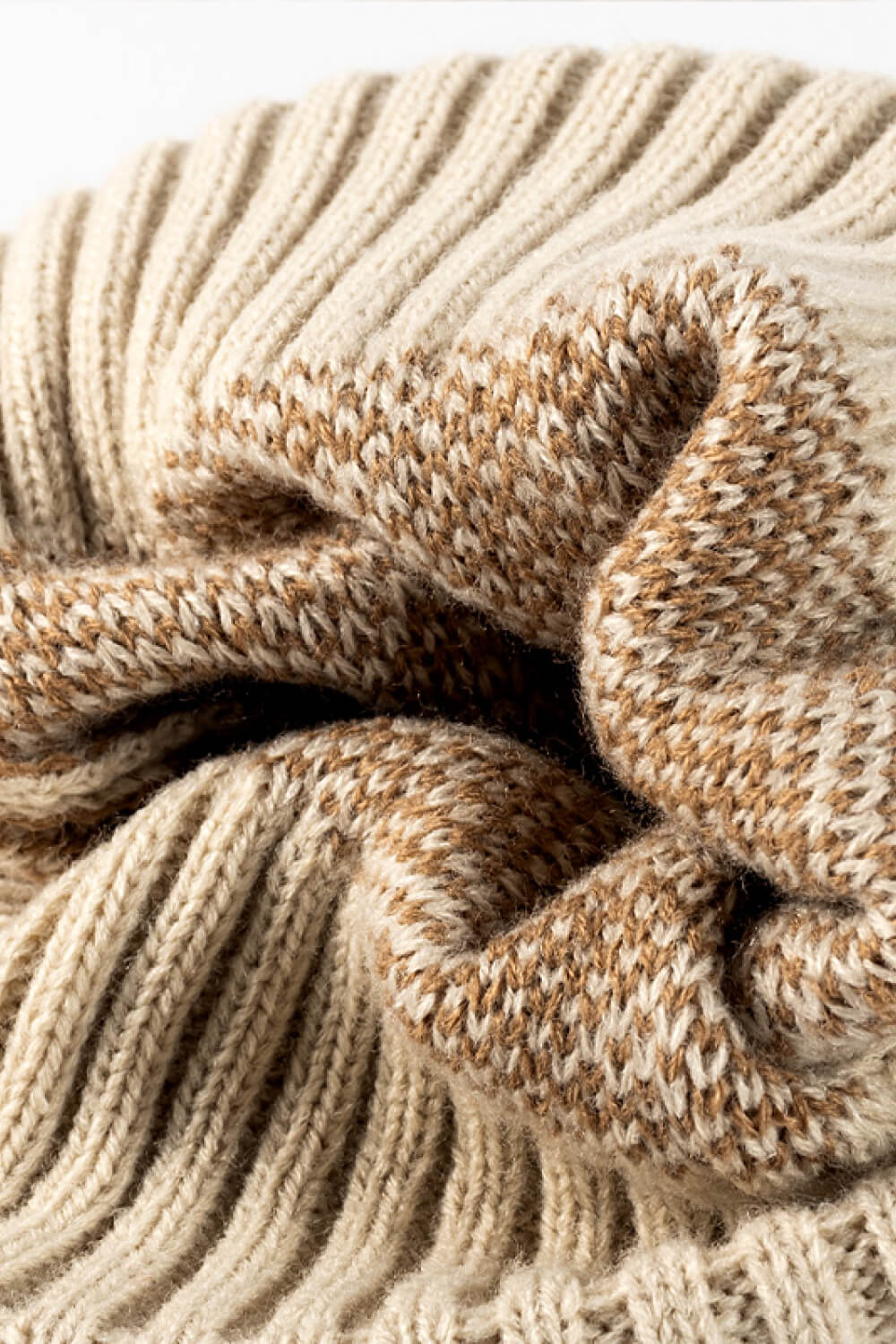 Leopard print pom-pom cuffed beanie by Trendsi, featuring a cozy knit design with playful faux fur pom-pom details.