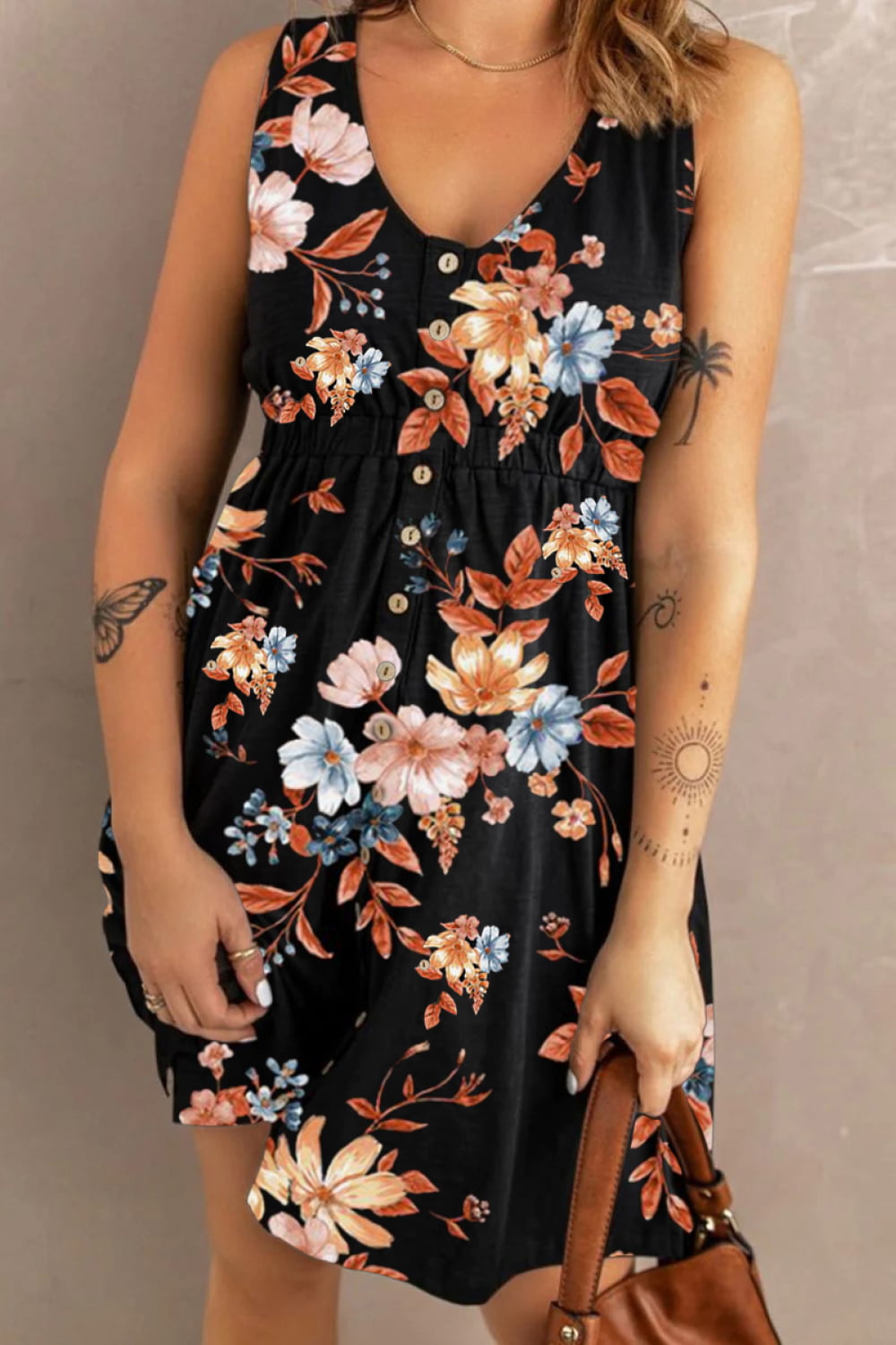 Printed sleeveless casual dress by Trendsi featuring front buttons, ruched waist, side slit, and pockets, perfect for everyday wear.
