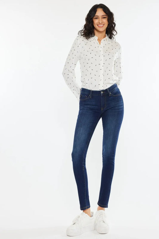 Kancan mid-rise super skinny jeans in dark wash with five-pocket design and classic denim texture.