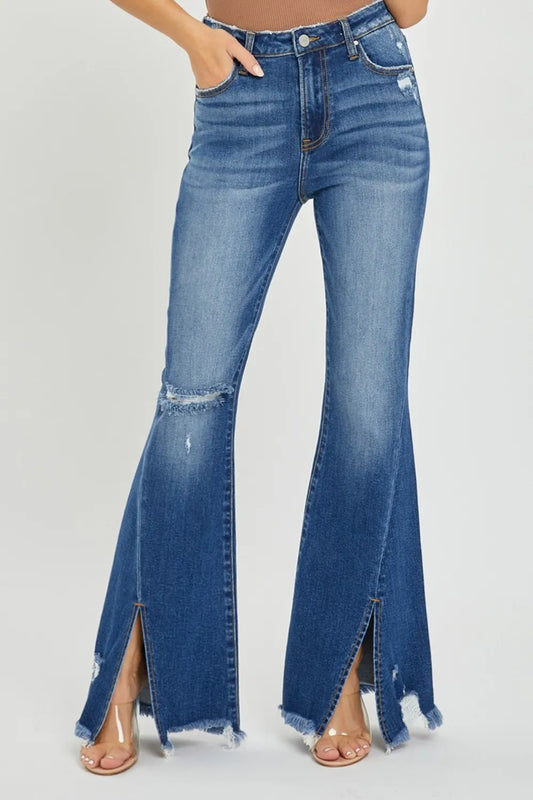 Trendsi RISEN full-size high-rise flare jeans with front slit, frayed hem, and high waist, styled with casual top and shoes.