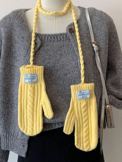 Cable knitted mittens with neck strap from Trendsi, featuring a cozy, textured knit pattern and adjustable strap for comfort.