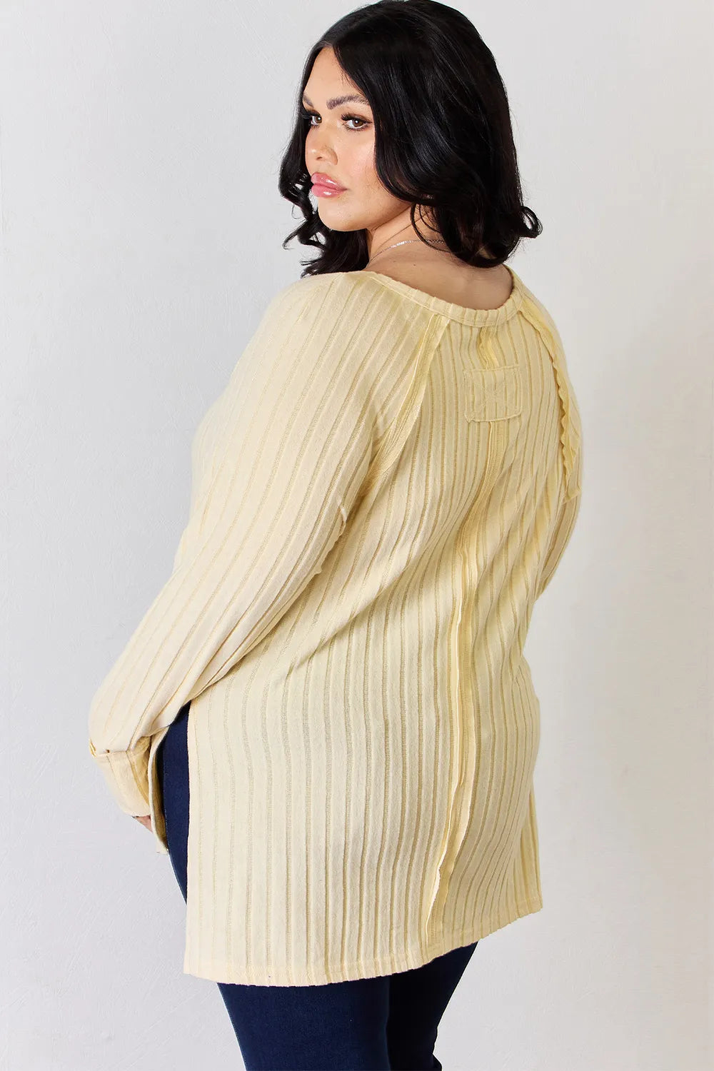 Basic Bae full-size ribbed round neck slit T-shirt by Trendsi, featuring a ribbed texture and a stylish slit detail in a casual fit.