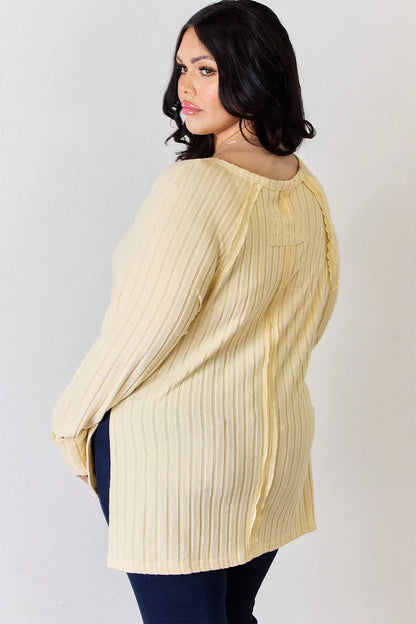 Basic Bae full-size ribbed round neck slit T-shirt by Trendsi, featuring a ribbed texture and a stylish slit detail in a casual fit.