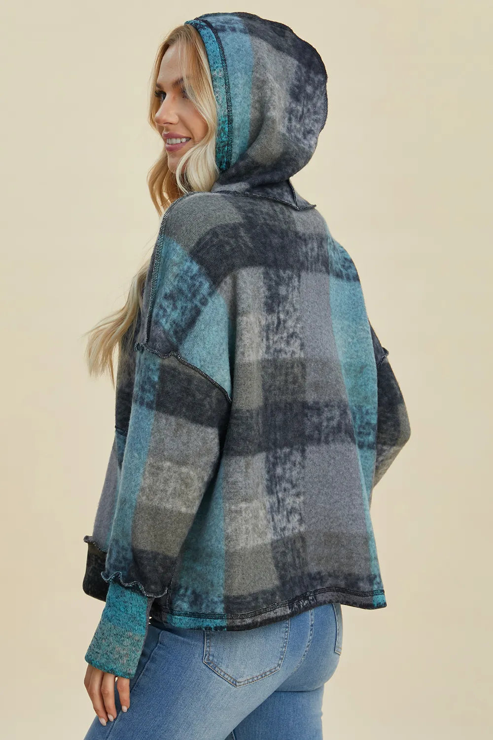 Plus size plaid fleece hoodie with dropped shoulders from Trendsi, featuring a cozy, full-size hoodie with a relaxed fit and plaid pattern.