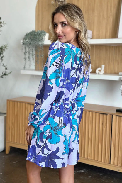 Trendsi Double Take floral long sleeve romper with pockets, full size, featuring a vibrant floral pattern and comfortable fit.