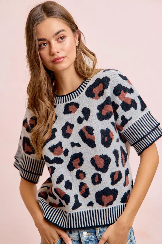 Leopard knit top with two-tone detail and double sleeves from Trendsi, featuring a stylish, textured fabric and long sleeves.