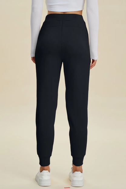 High waist black scuba joggers with drawstring waist and relaxed fit, from Basic Bae by Trendsi, styled for casual comfort.
