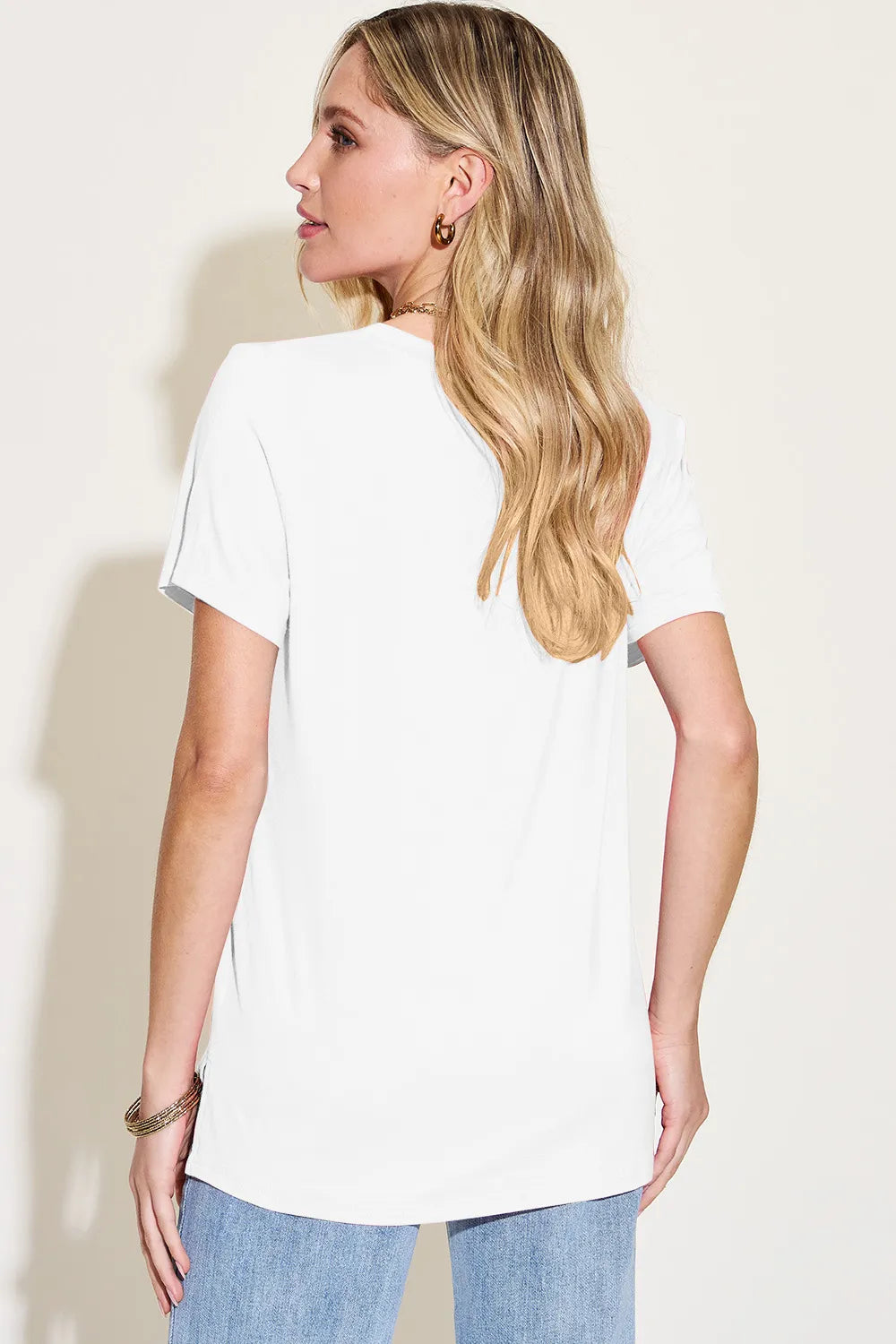 Basic Bae bamboo V-neck high-low T-shirt by Trendsi, full size, soft fabric, and stylish design shown on a model.