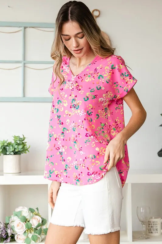 Heimish full-size animal print V-neck short sleeve T-shirt in plus size, featuring a bold animal pattern and comfortable fit.
