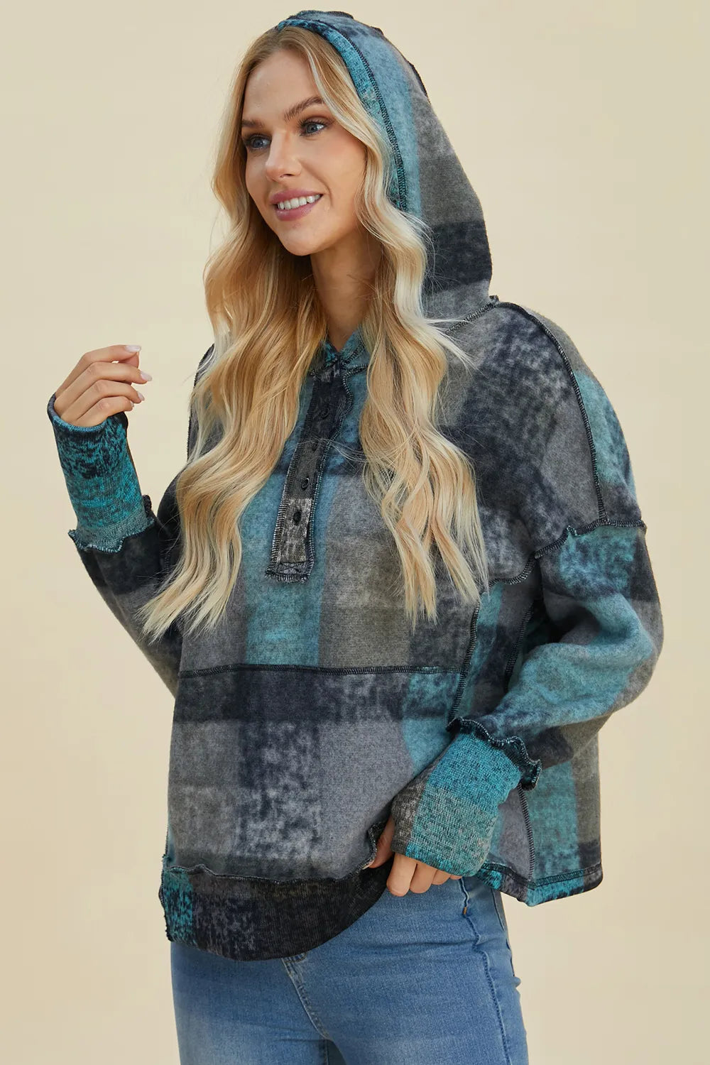 Plus size fleece hoodie with plaid pattern, dropped shoulder design, and cozy fit from Trendsi's Double Take collection.