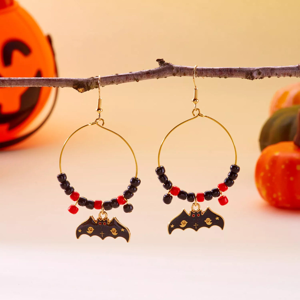 Halloween Bat Charm Hoop Earrings by Trendsi featuring black bat-shaped charms on silver hoops.