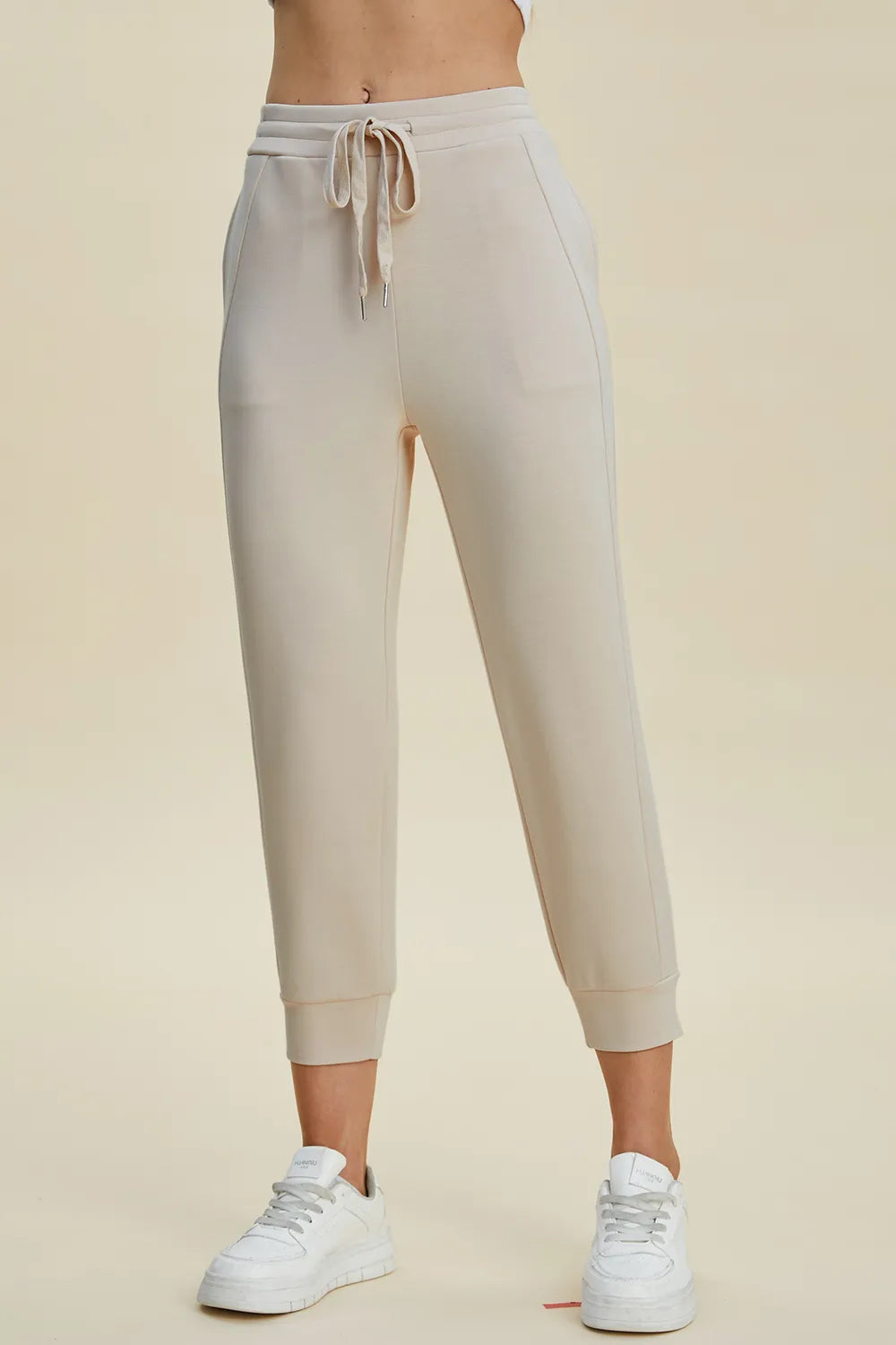 High waist cropped scuba pants by Trendsi featuring a drawstring and full size air-style design in soft fabric.