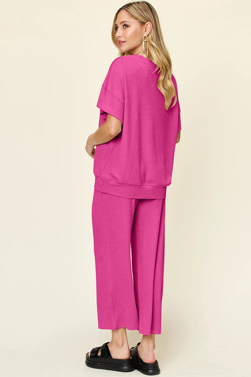 Trendsi Double Take full size texture round neck short sleeve T-shirt with wide-leg pants, showcasing casual stylish outfit.