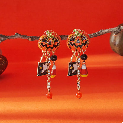 Halloween pumpkin drop earrings featuring orange pumpkin charms hanging from gold-tone hooks, perfect for festive fall accessories.