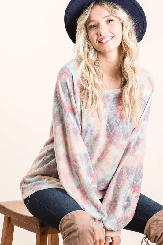 BiBi brushed tie dye print top with puff sleeves, featuring vibrant colors and a relaxed fit, styled for casual or trendy outfits.