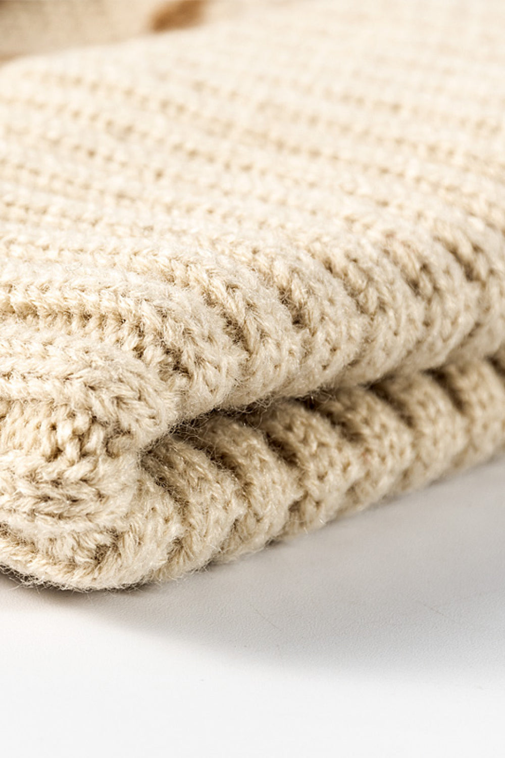 Leopard print pom-pom cuffed beanie by Trendsi featuring a cozy knit design with playful leopard pattern and fluffy pom-pom detail.