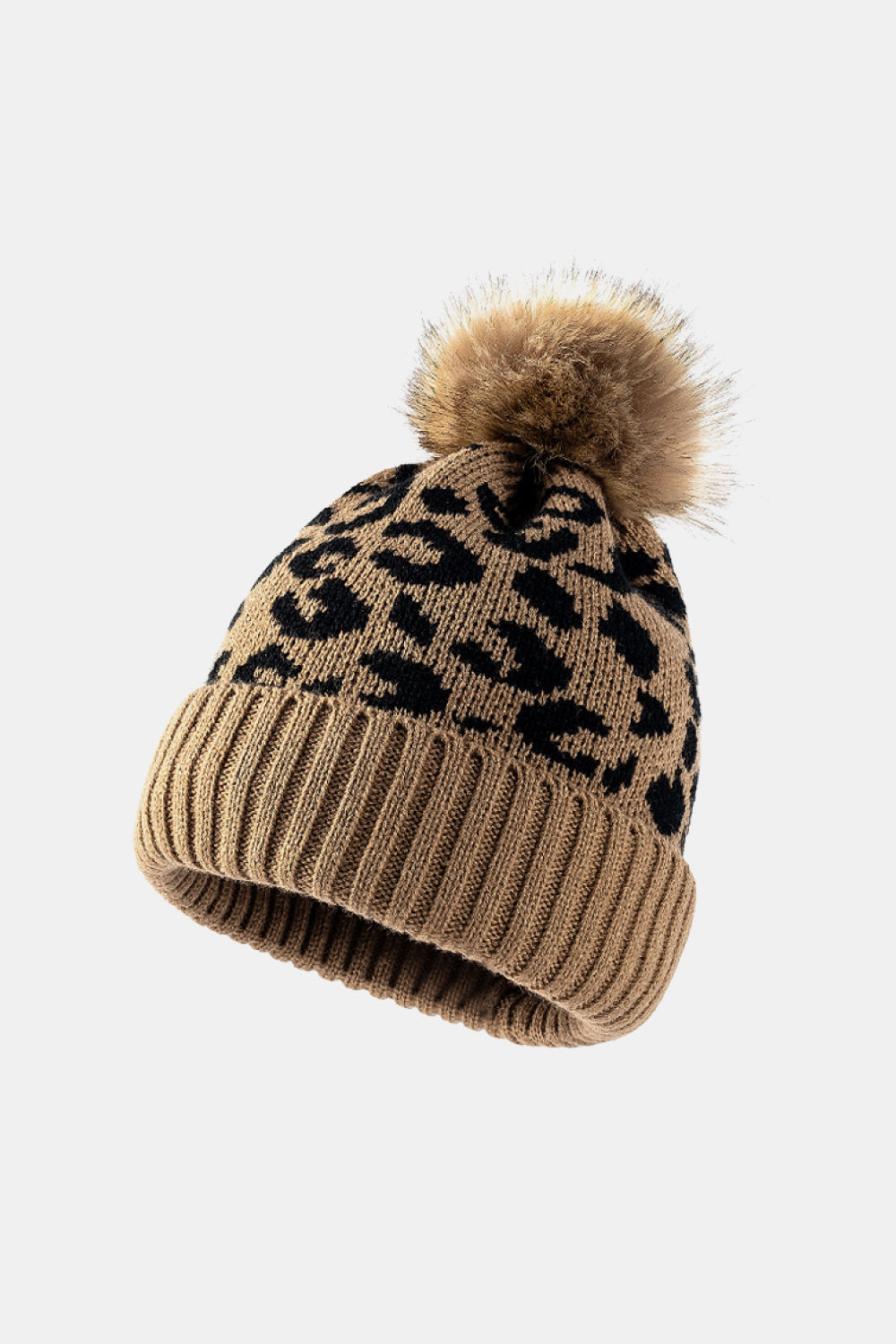 Leopard print pom-pom cuffed beanie by Trendsi featuring a cozy knit design with playful fur pom-pom detail.