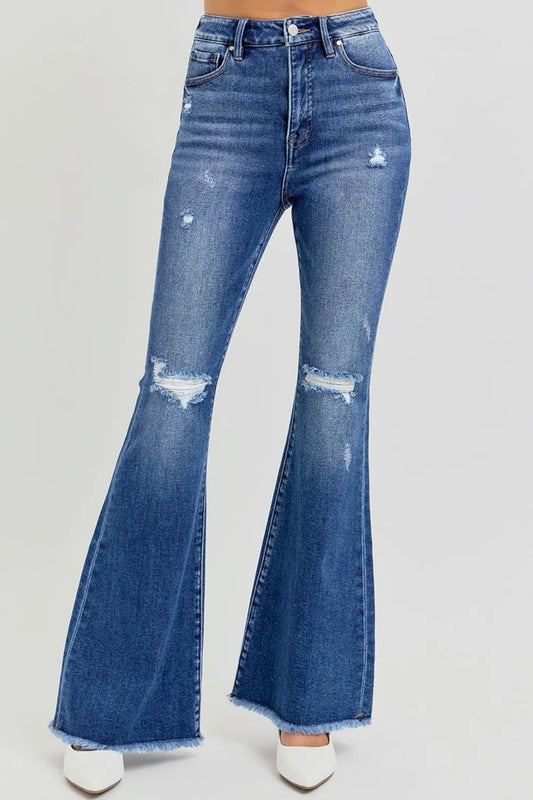 Trendsi RISEN full size high rise distressed raw hem flare jeans displayed on a hanger. Denim jeans with a distressed finish and raw hem.