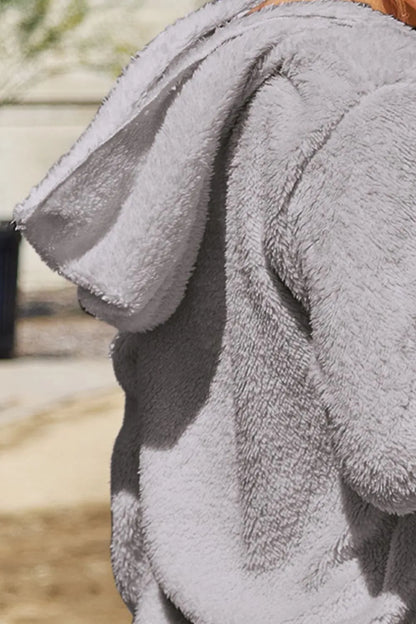 Full size Teddy hooded jacket with pockets, cozy and plush, by Trendsi, featuring a soft, furry texture and a comfortable hood.