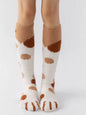 Fuzzy knee-high animal paw socks in soft fabric with paw print design, perfect for cozy, fun footwear styles.