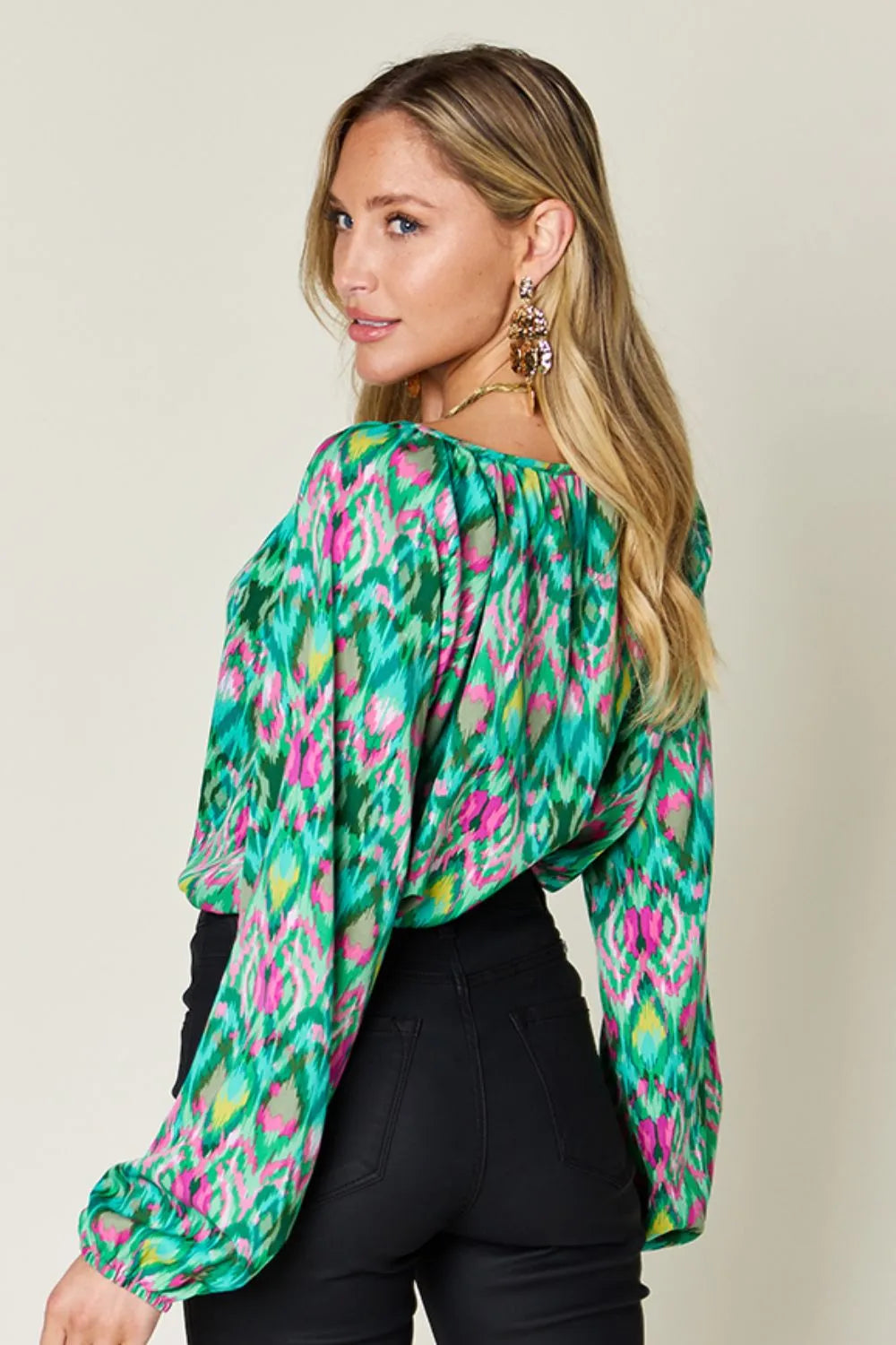 Printed balloon sleeve blouse from the Double Take collection by Trendsi, featuring bold full-size design and stylish balloon sleeves.