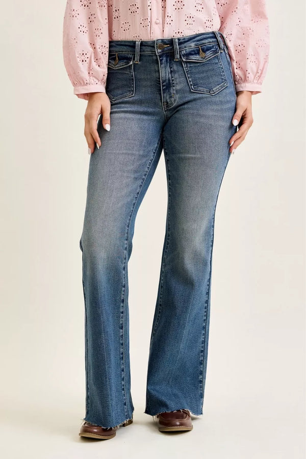 Judy Blue mid-rise flare jeans with front flap pockets, casual denim style, showcasing the fit and design details.