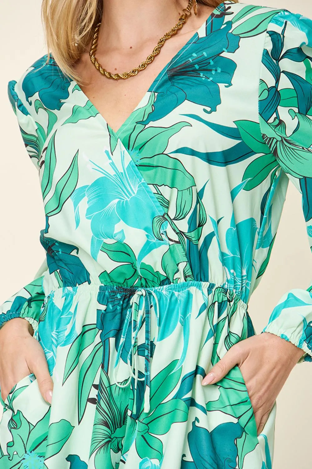 Double Take floral long sleeve romper with pockets, featuring a full-size design and stylish pattern from Trendsi.