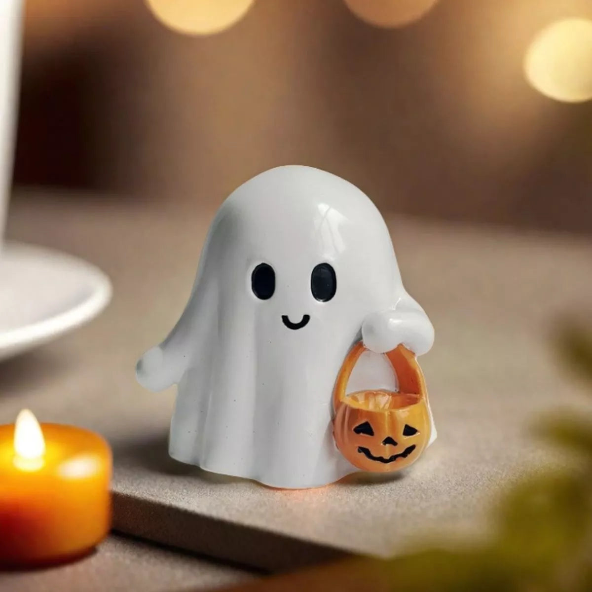 Halloween ghost ornament holding a pumpkin basket, decorative holiday figure by Trendsi for Halloween decor.