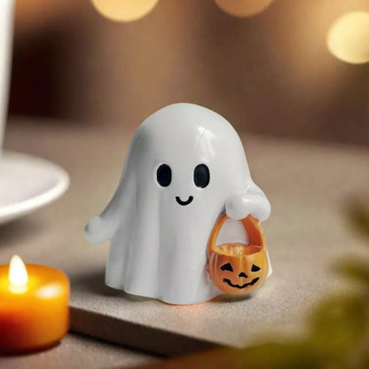 Halloween ghost ornament holding a pumpkin basket, decorative holiday figure by Trendsi for Halloween decor.