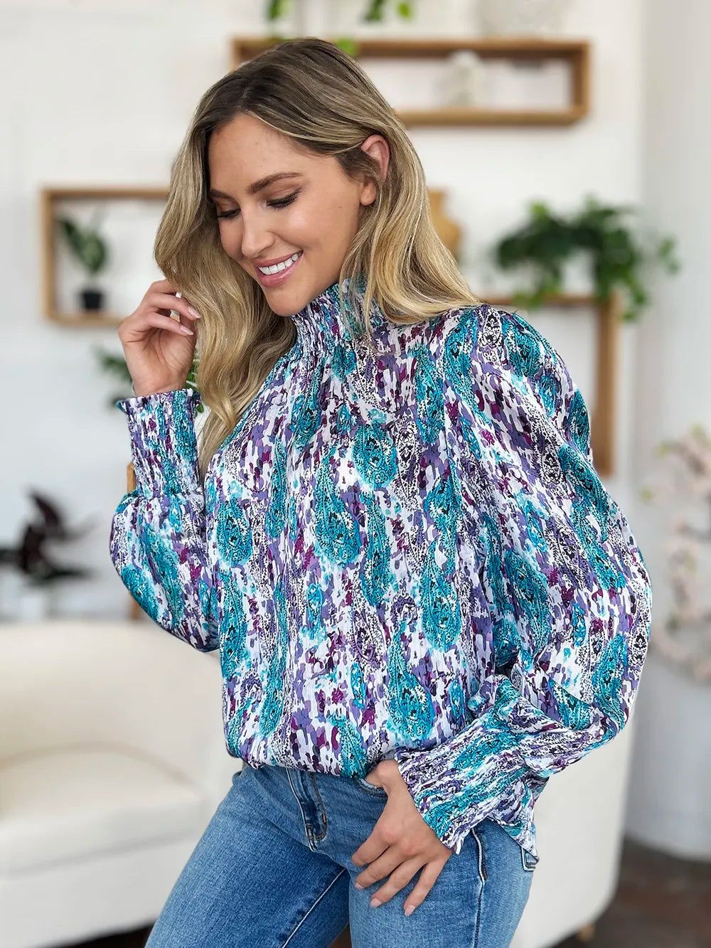 Printed smocked long sleeve blouse from Trendsi featuring a double take full size design with a fitted, stylish look.