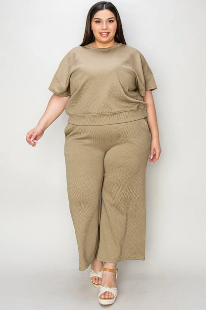 Trendsi Double Take full size texture short sleeve top and matching pants set, stylish casual loungewear in a textured fabric.