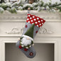 Red Christmas stocking hanging widget from Trendsi, decorated with festive patterns and a white cuff, ideal for holiday decor.