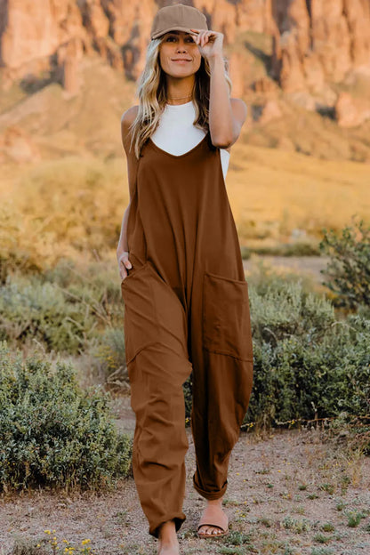 Trendsi Double Take full size sleeveless v-neck jumpsuit with pockets, showcasing its stylish design and comfortable fit.