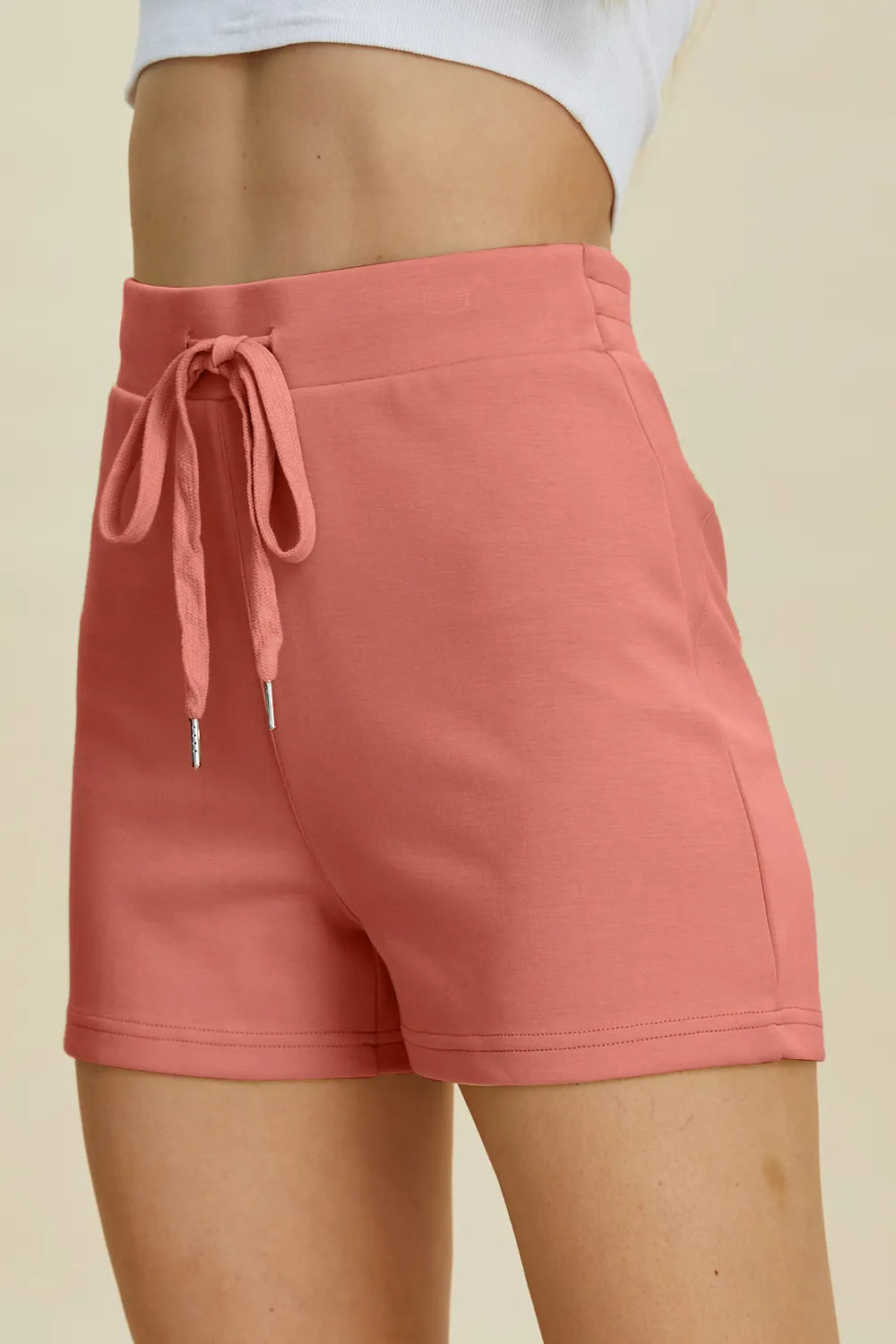 Basic Bae high waist scuba shorts by Trendsi, with drawstring closure and full size design, shown in black fabric.