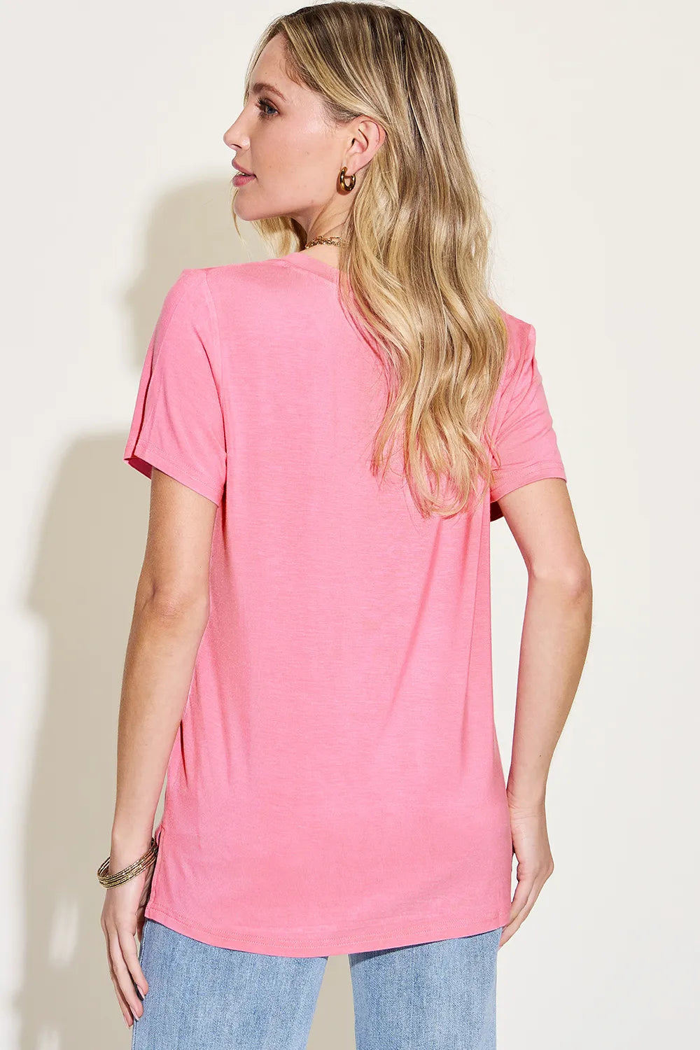Basic Bae full size V-neck high-low T-shirt by Trendsi, showing the front view in black with a relaxed fit and high-low hem.