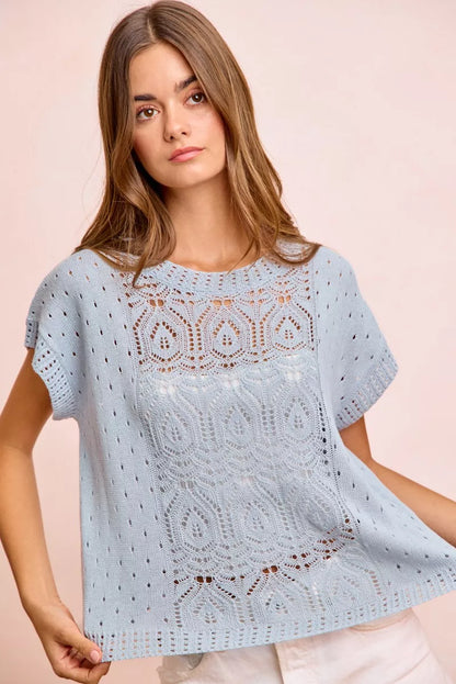 BiBi Washed Eyelet Short Sleeve Knit Top by Trendsi, featuring breathable fabric and eyelet details in a casual style.