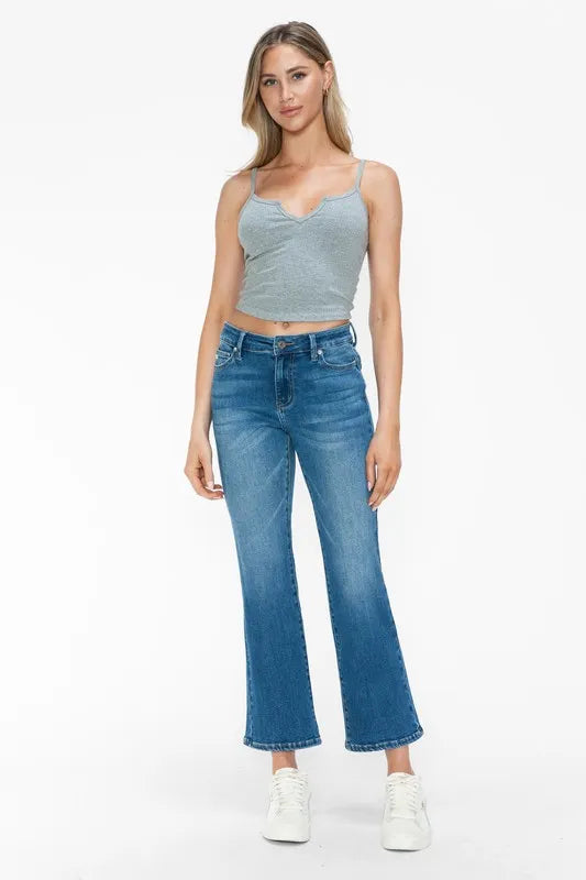Bytos full size cat's whiskers mid-rise ankle jeans with distressed details and classic five-pocket design on a model.