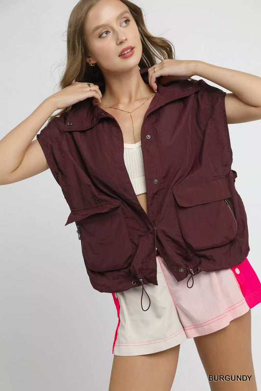 Trendsi Umgee nylon vest with drawstring hem, front pockets, lightweight design, black color, suitable for casual wear.
