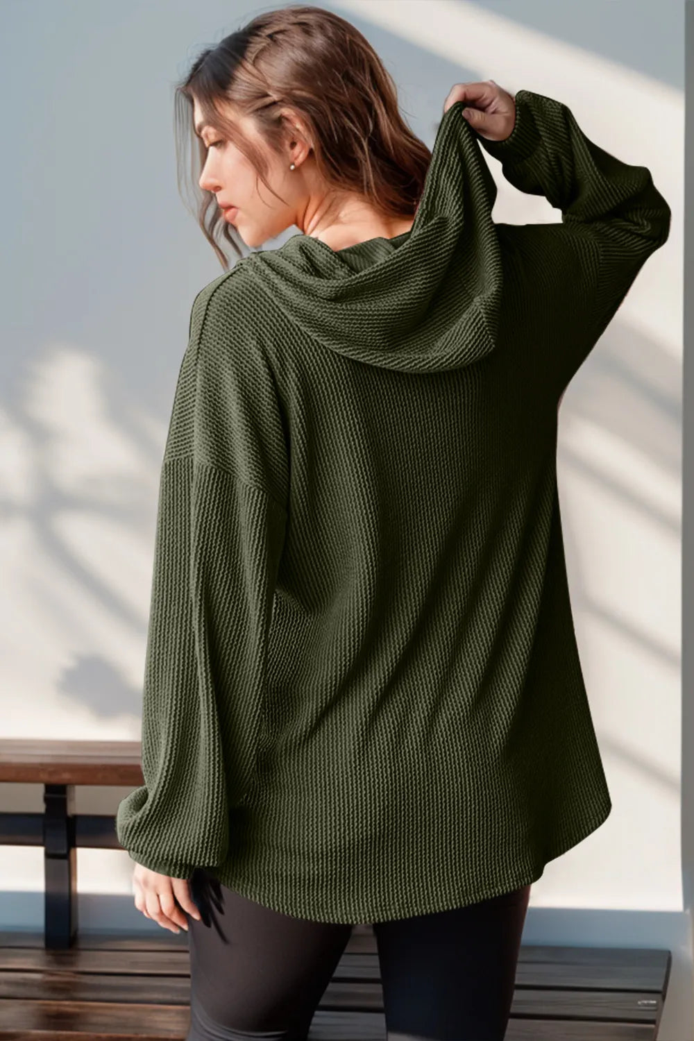 Long sleeve hoodie with half button front, featuring a double take full size design in soft fabric, from Trendsi.