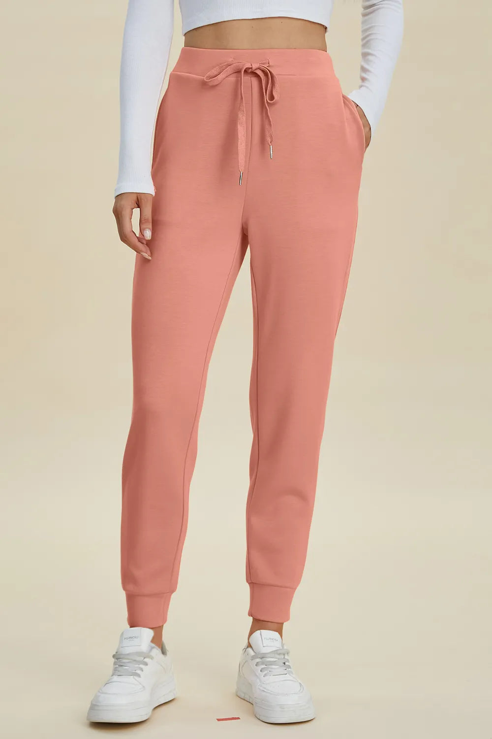 Black high waist joggers from Trendsi's Basic Bae Air Scuba collection with drawstring waist and relaxed fit.
