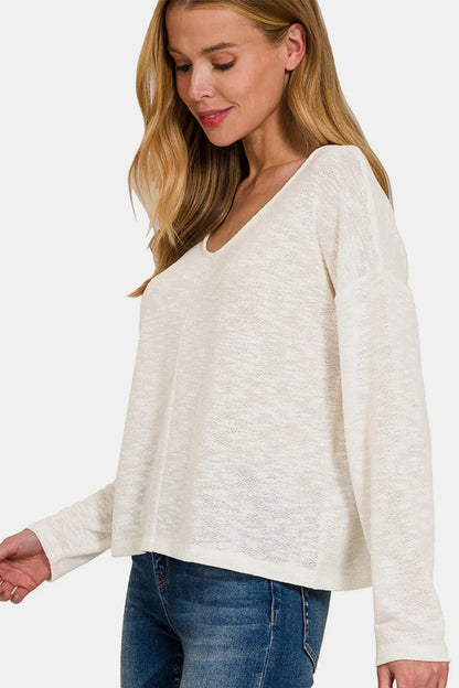 Black Zenana V-neck dropped shoulder long sleeve T-shirt with relaxed fit, casual style, and soft fabric for comfortable wear.
