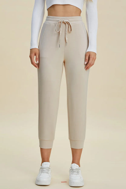 Black high waist cropped scuba pants with drawstring, from Trendsi's Basic Bae collection, featuring a full-size air scuba fabric.