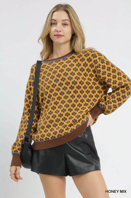 Umgee abstract print crew neck sweater featuring vibrant, artistic patterns and a comfortable fit, ideal for casual wear.