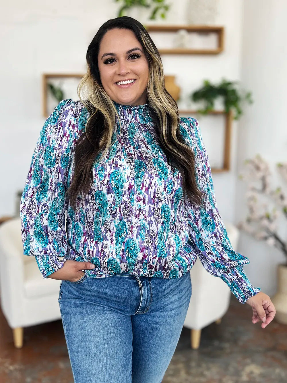 Printed smocked long sleeve blouse from Trendsi, featuring a double take full-size design with gathered fabric and stylish details.