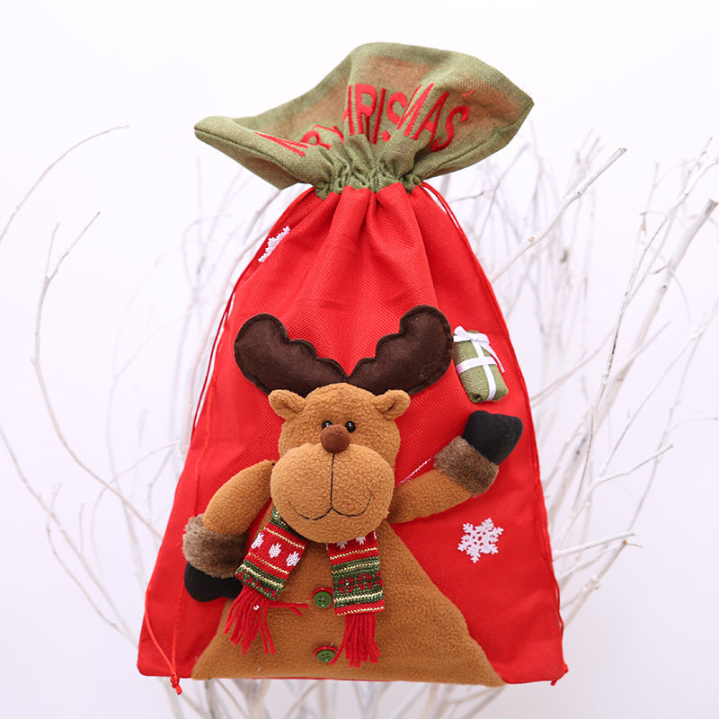 Red drawstring Christmas gift bag by Trendsi with festive holiday pattern and spacious interior for wrapping presents.