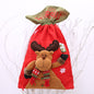 Red drawstring Christmas gift bag by Trendsi with festive holiday pattern and spacious interior for wrapping presents.