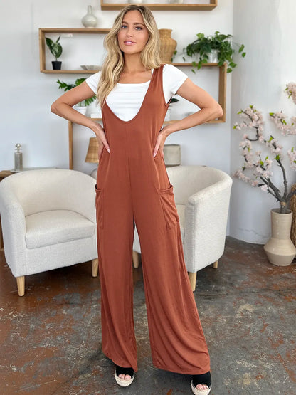 Plus size Trendsi Double Take sleeveless wide-leg jumpsuit with pockets, full length, casual fit, in a solid color.