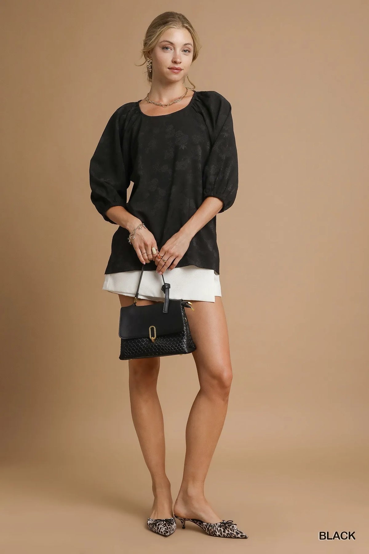 Umgee satin jacquard balloon sleeve blouse with a relaxed fit and elegant design, featuring intricate patterns and a stylish silhouette.
