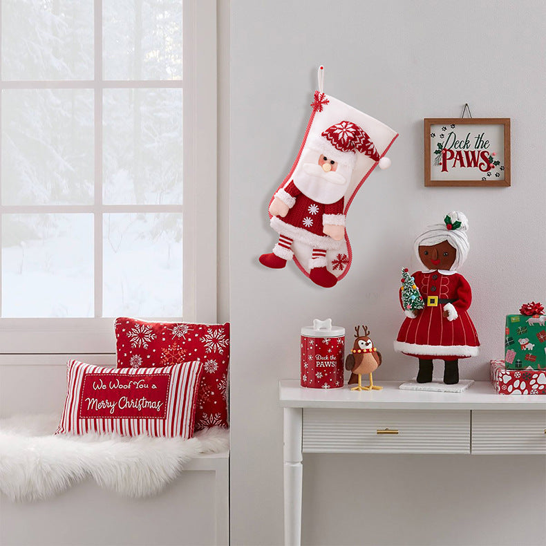 Red Christmas stocking hanging widget from Trendsi with a festive design, perfect for holiday decor.